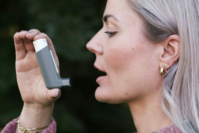 A woman holding a cell phone up to her face